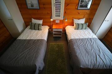 Фото номера Вилла с двумя спальнями и сауной. Курортные отели Rauhalahti Holiday Homes г. Куопио 16