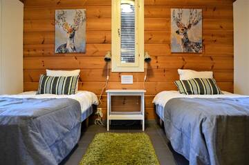 Фото номера Вилла с 3 спальнями и сауной Курортные отели Rauhalahti Holiday Homes г. Куопио 10