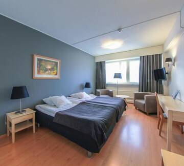 Фото номера Двухместный номер эконом-класса с 2 отдельными кроватями Отель Economy Hotel Savonia г. Куопио 3